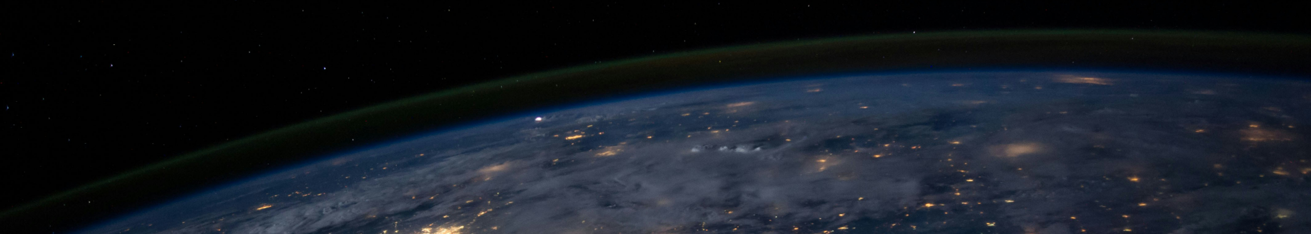 Dark world at night with glowing auras on countries